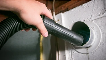 Undergoing dryer vent cleaning service for residential home in Wichita KS.