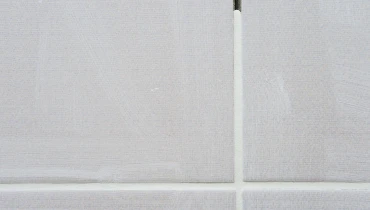 Tile undergoing grout repair service in residential home in Norfolk County.