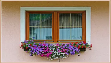Window decorated with flowers. 
