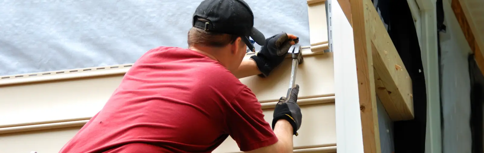 Vinyl siding being installed on a house