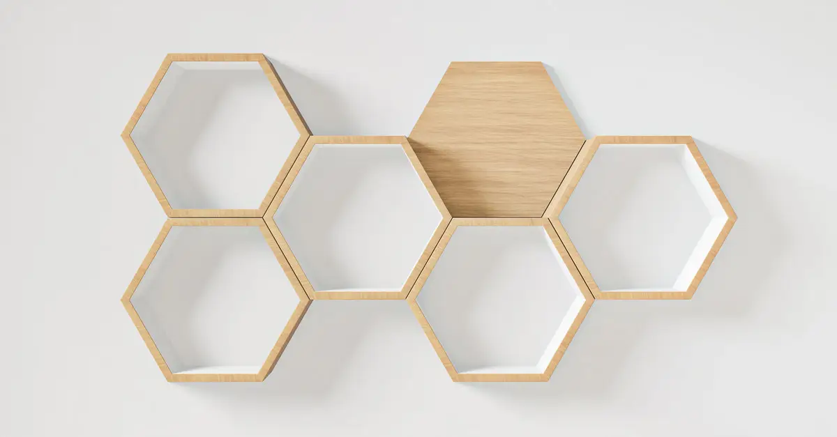 Hexagon-shaped floating shelves hung on a wall with professional hanging services.