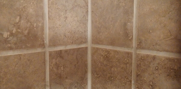 The grout lines in a tiled wall after they have been fixed with grout repairs in Flower Mound, TX.