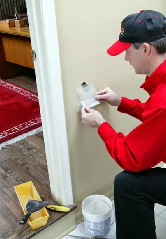 Mr. Handyman repairing drywall in Keller home