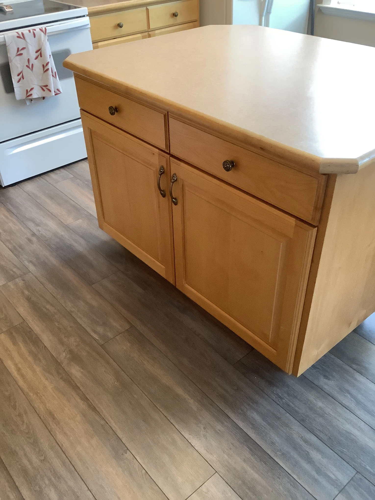 Newly built lower cabinets installed underneath a kitchen island in a home that has recently received professional service for finish carpentry in Lehi, UT.