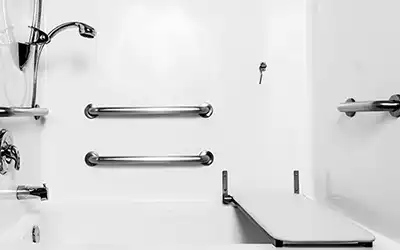 Shower with grab bars and seat installed.