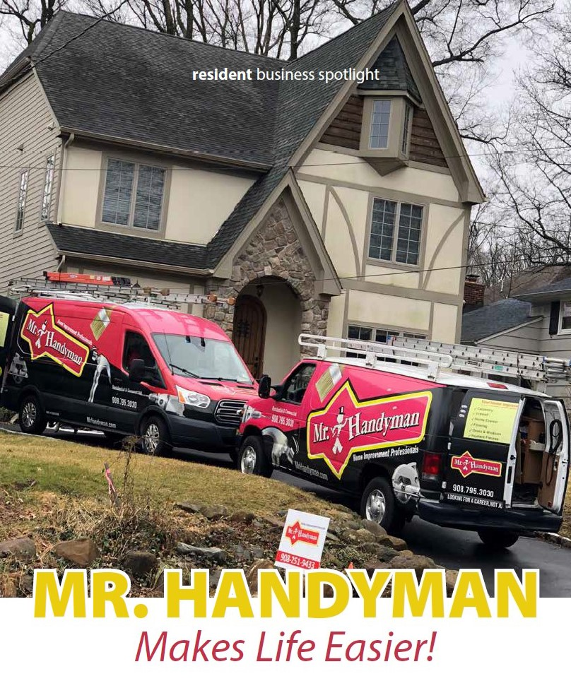 Two Mr. Handyman Vans in front of home
