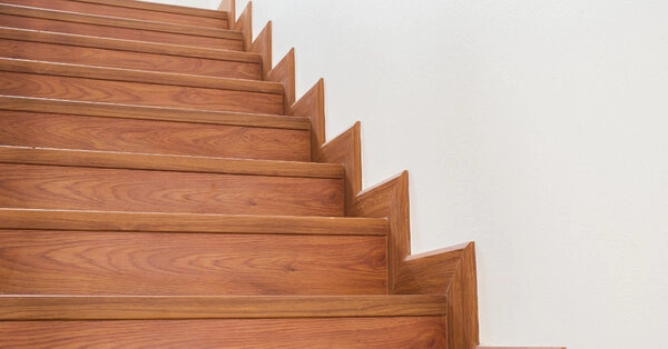 A set of interior steps inside of a modern home that have been kept in good condition with professional step repair services.