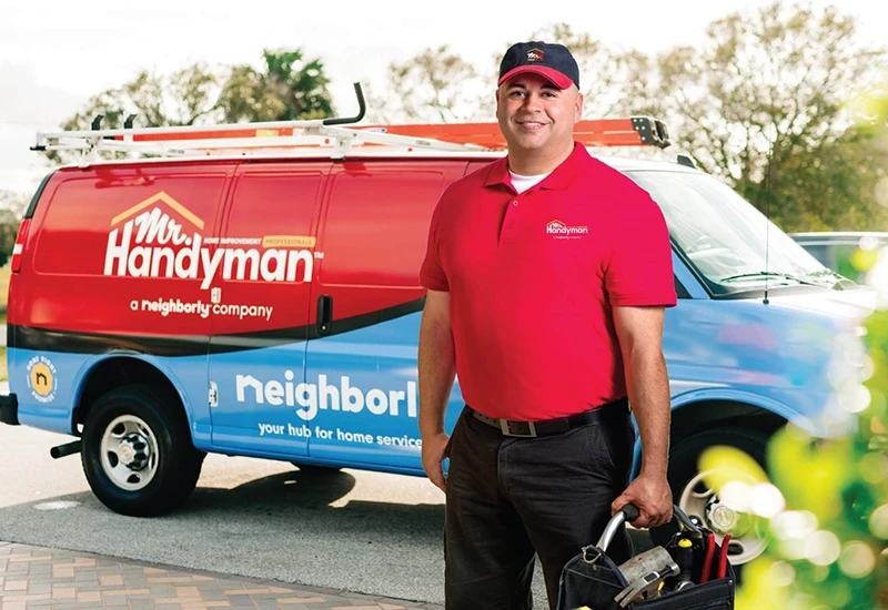 Mr. Handyman tech ready to perform home improvement services.