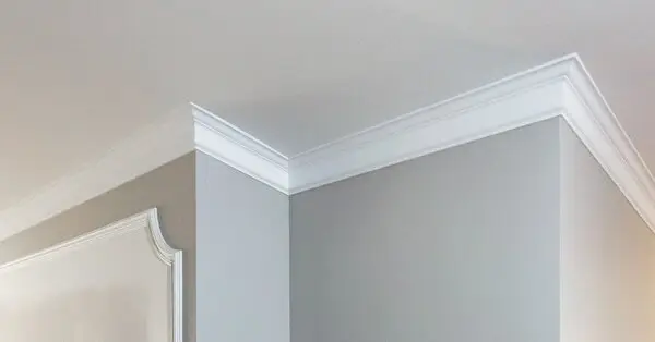 The top of an interior wall with crown molding in Wichita, KS.