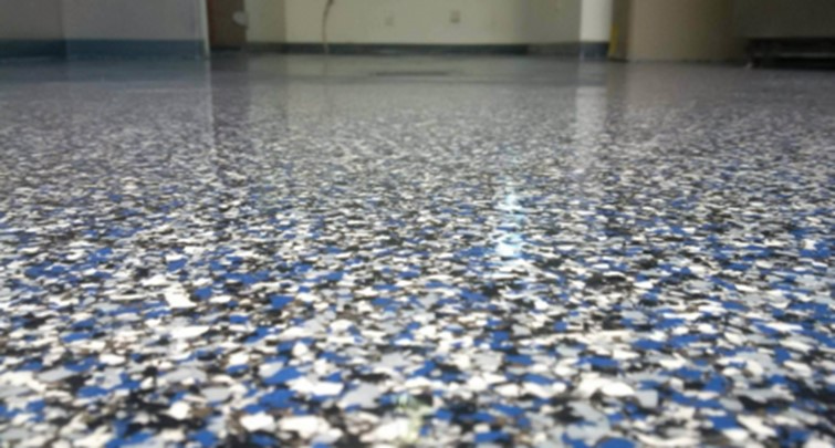 Non-skid flooring with a mosaic, blue and white pattern installed in a home as an aging in place modification.