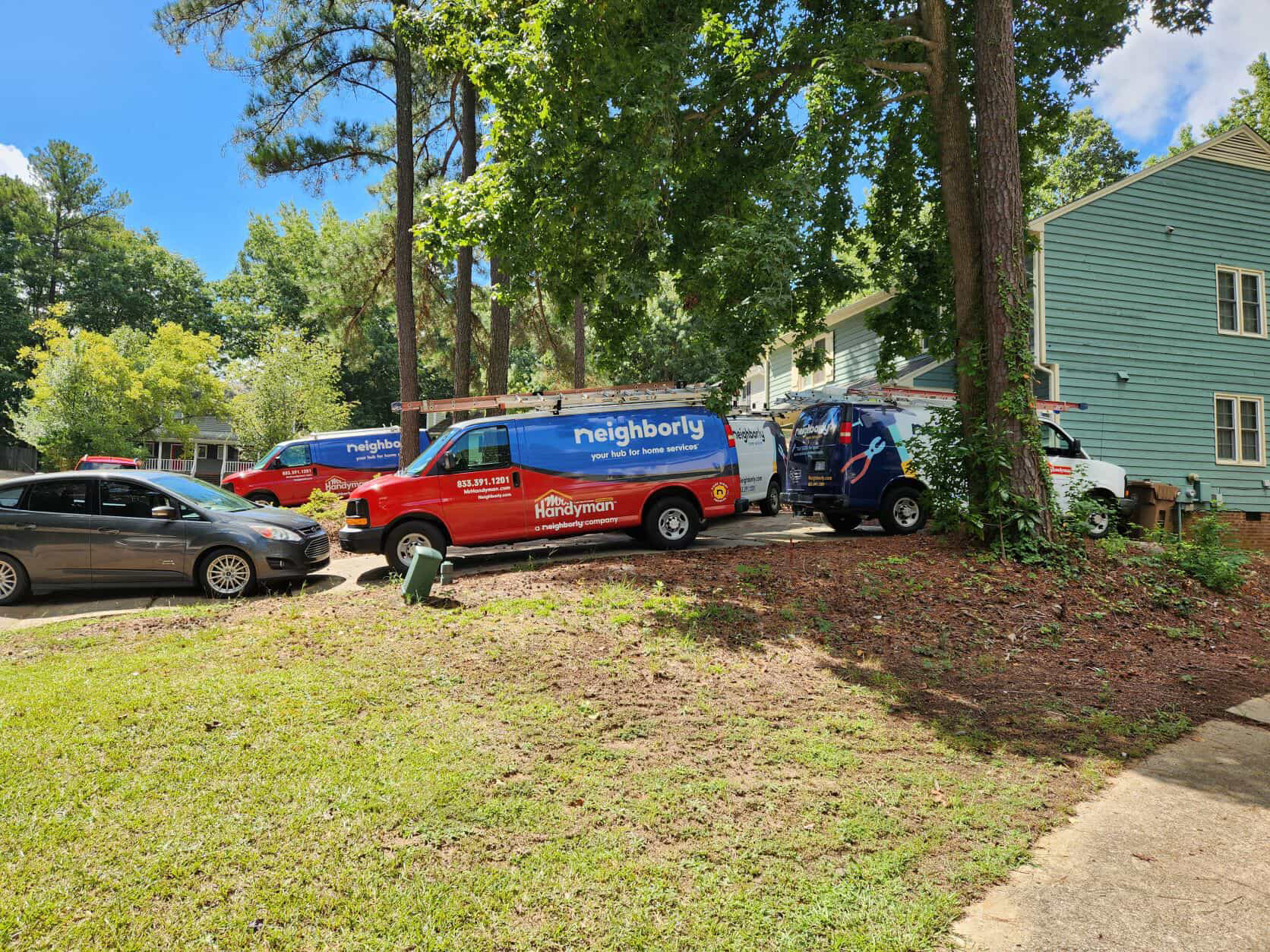 Mr. handyman vans in a driveway