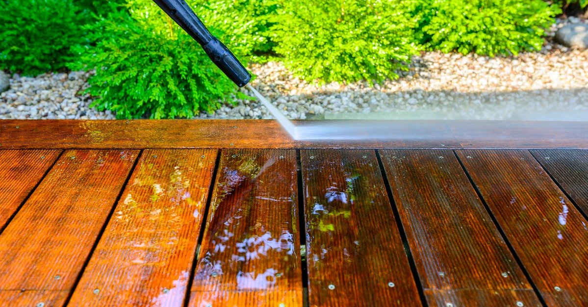 A deck being pressure washed.