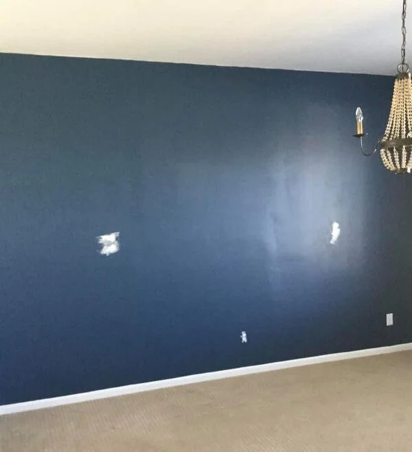  A wall in a home after a handyman has completed drywall repairs in Brighton, CO.