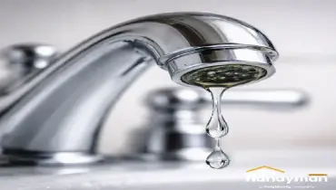 handyman repairing leaking faucet in Martinsburg WV home bathroom