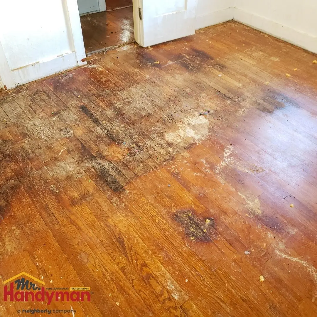 Mr. Handyman technician installing luxury vinyl plank flooring in a Plano, Texas home.