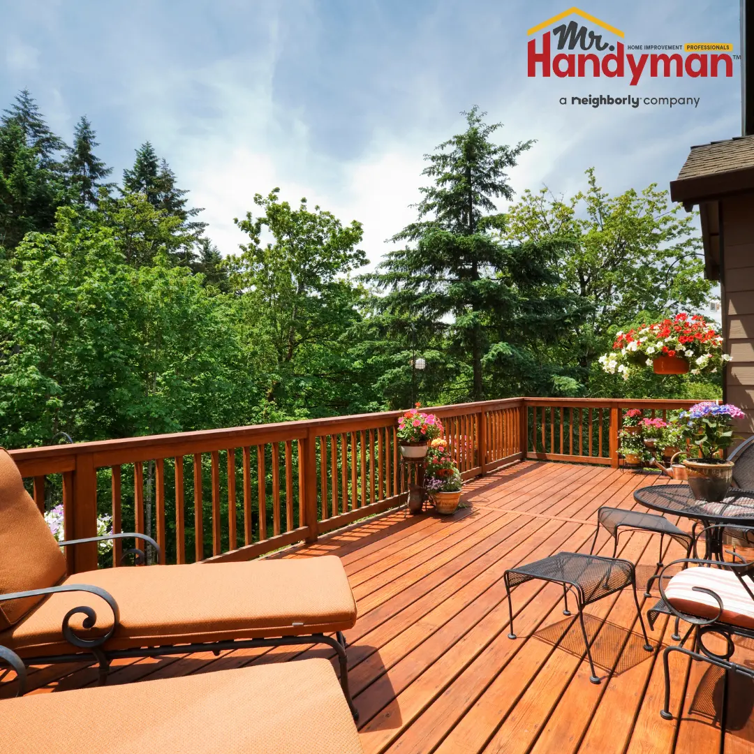 Handyman repairing a deck railing at a Rockwall, TX home