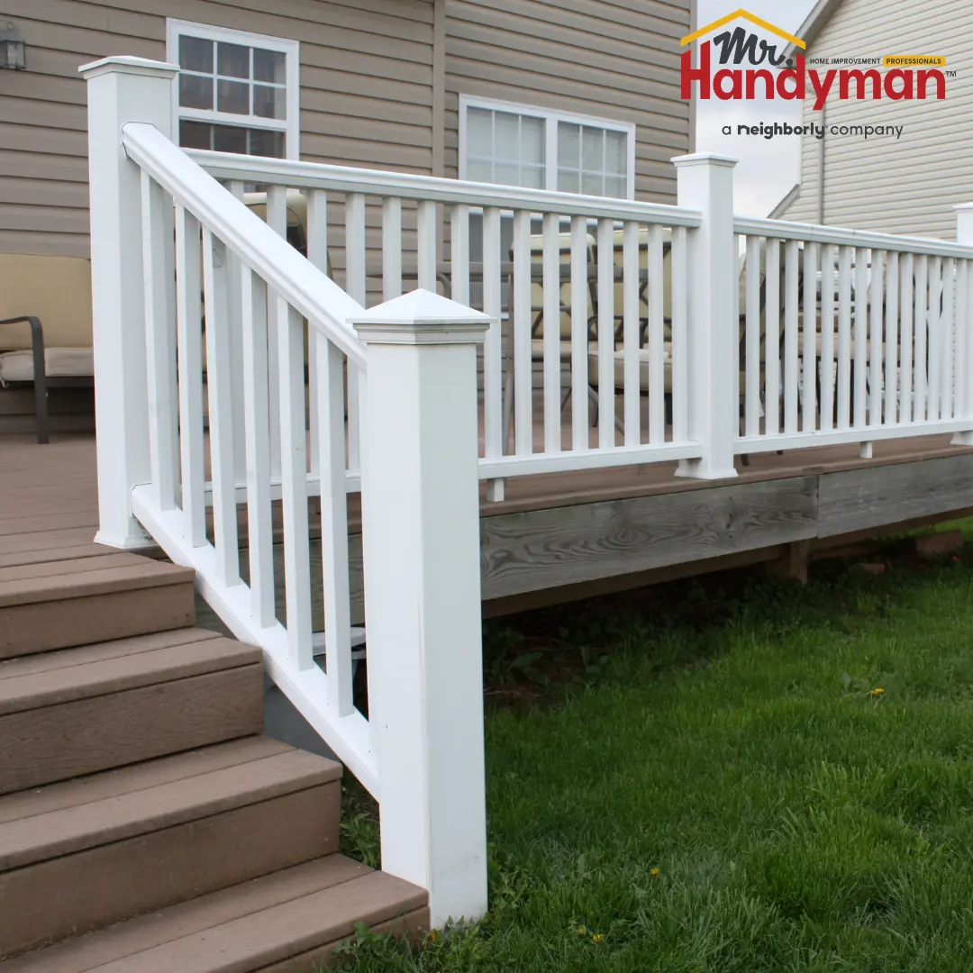 Handyman repairing a deck railing at a Rockwall, TX home