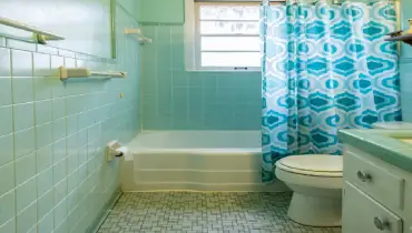 Handyman installing a new vanity faucet in an Elkhart, IN bathroom.