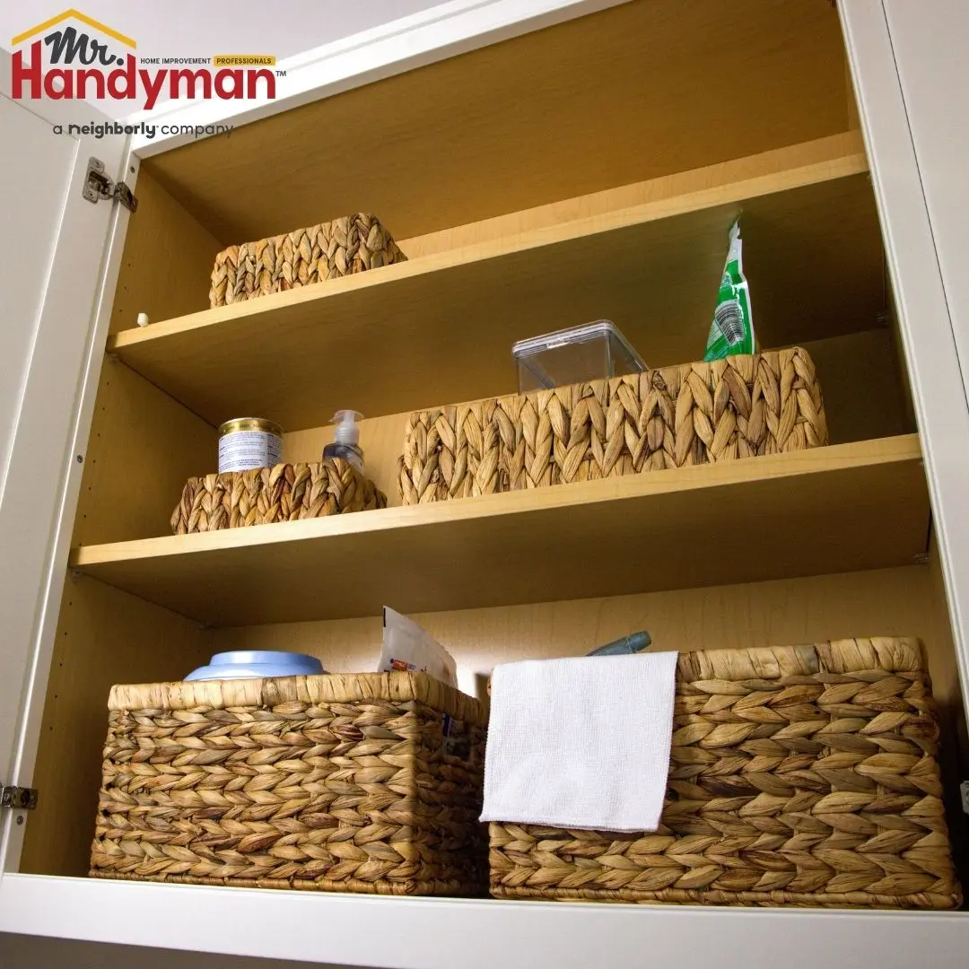 Mr. Handyman technician installing built-in mudroom bench and storage in a Plano, Texas home.