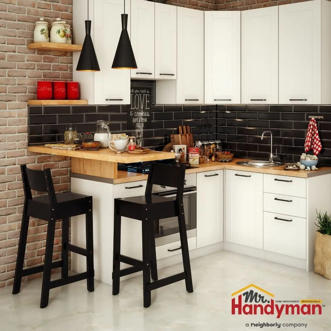 Mr. Handyman technician installing kitchen island cabinetry in a Plano, Texas home ahead of summer entertaining season.
