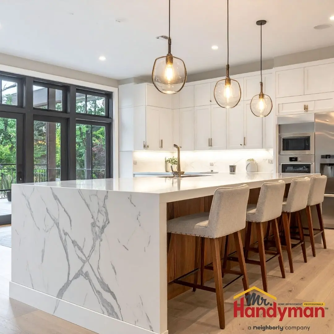 Mr. Handyman technician installing kitchen island cabinetry in a Plano, Texas home ahead of summer entertaining season.