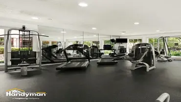 Handyman assembling commercial gym equipment in a fitness facility in Murfreesboro TN.