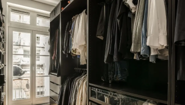 Handyman repairing interior drywall crack during winter in Allentown Pennsylvania home.