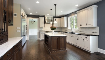 Dark wood kitchen with white cabinetry