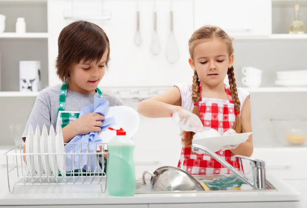 boy and girl washing dishes