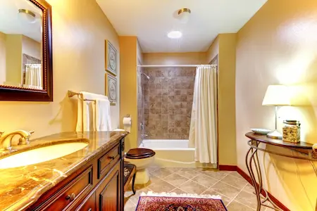 tan bathroom with tiled backsplash