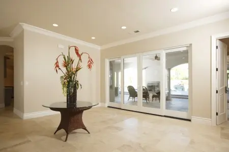 foyer of a house with stand and flowers