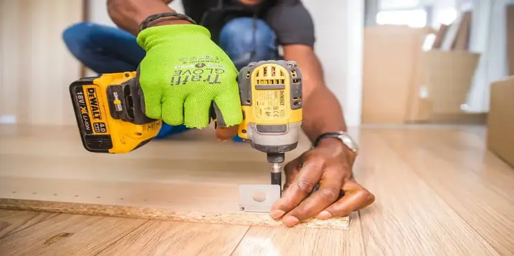 A man drilling.