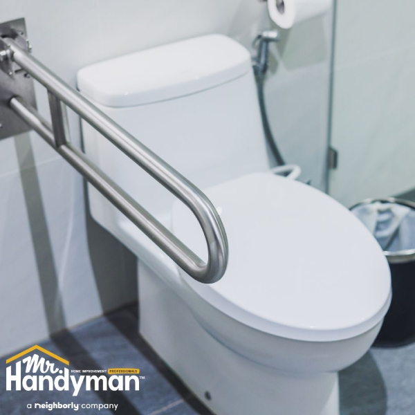 Toilet grab bar installation.