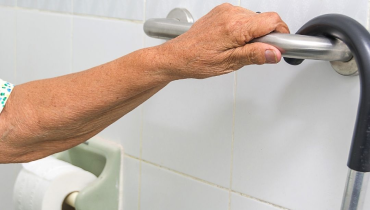Shower with ADA-compliant grab bars and handheld showerhead installed by Mr. Handyman of Charleston and Summerville.