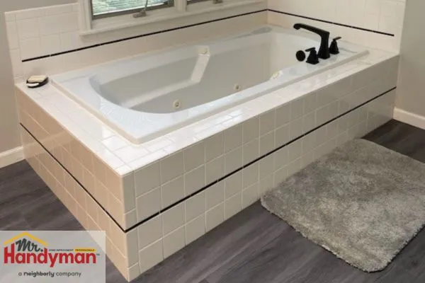 Mr. Handyman professional installing shower tiles in Northern St Joseph