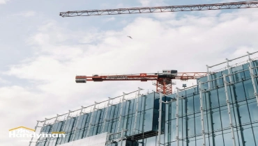 Mr. Handyman technician repairing a commercial building exterior in Charleston SC before busy season.
