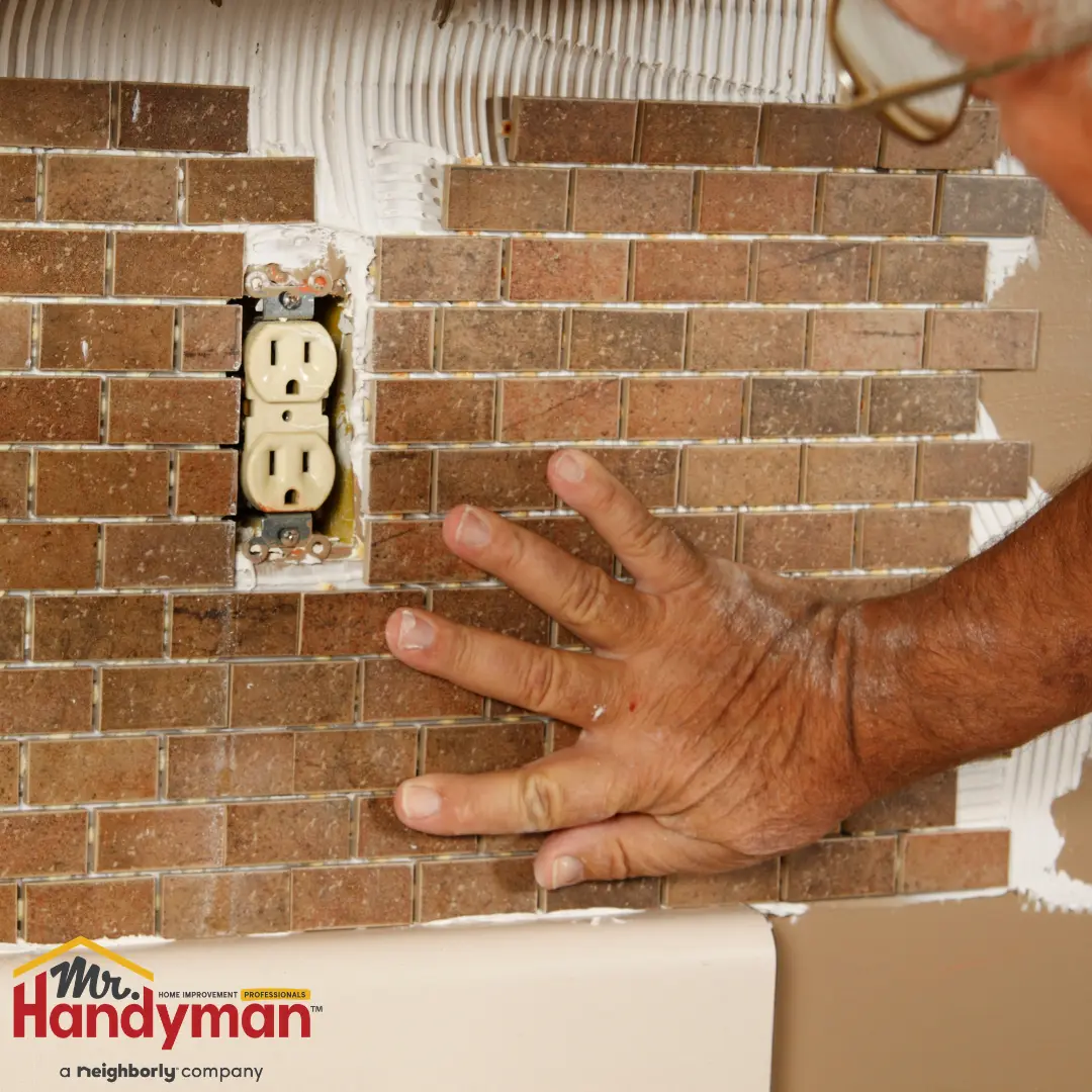 Mr. Handyman fixing the wiring issue.