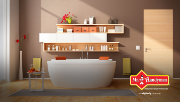Bathroom with the Mr. Handyman logo on the bottom right.