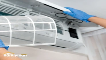 Mr. Handyman inspecting home exterior in preparation for summer in Oklahoma City OK.