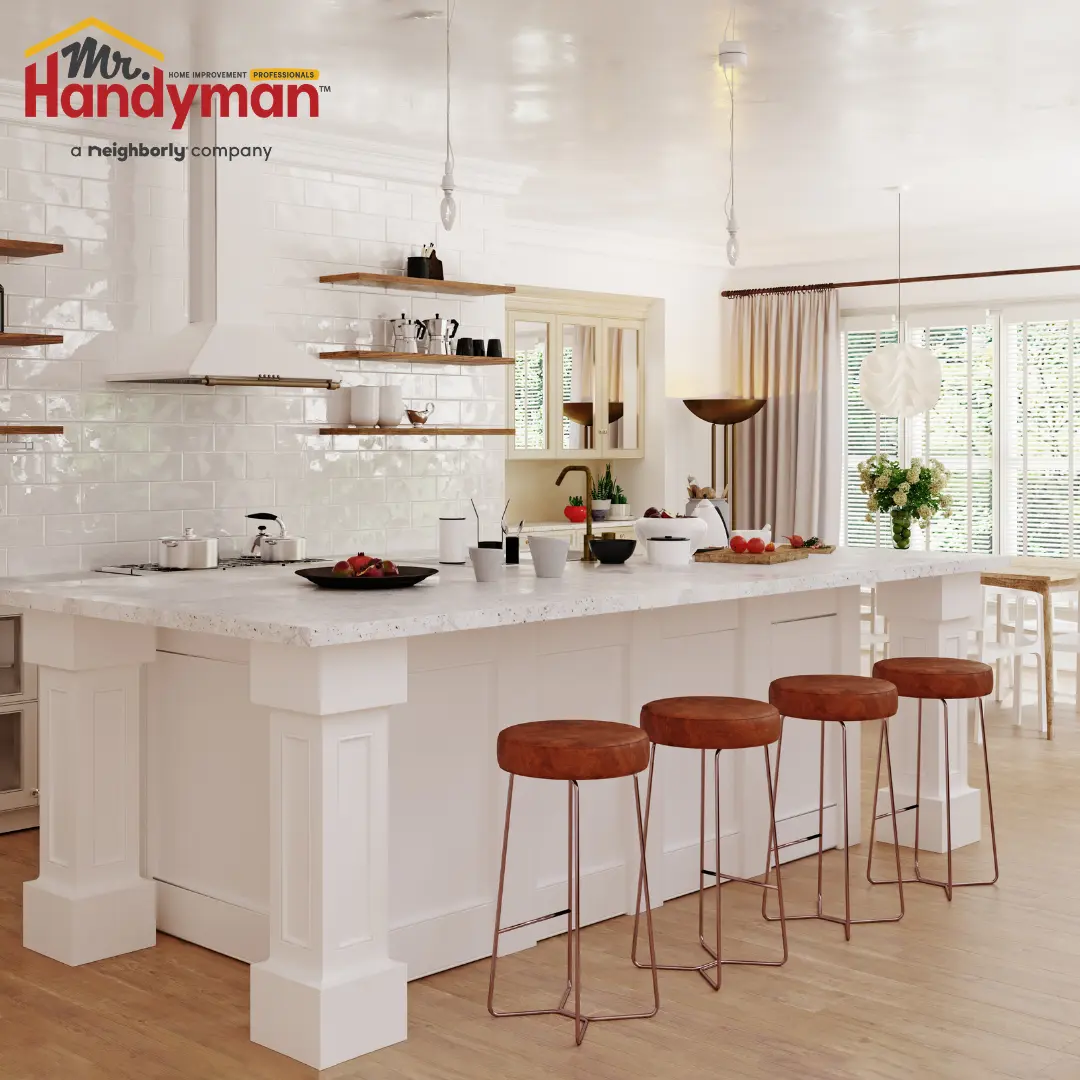 Mr. Handyman technician restoring a deck surface and installing outdoor lighting at a South Bend, Indiana home during summer.