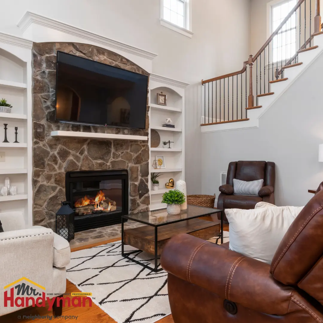 Mr. Handyman technician installing crown molding and fresh paint in a South Bend, Indiana living room modernization project.