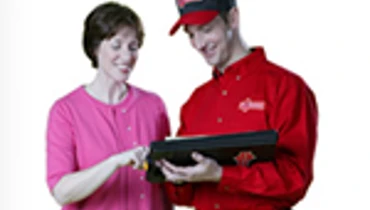 Handyman employee talking to a woman.