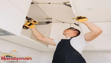 Handyman performing a routine maintenance inspection on a Rockwall, TX home