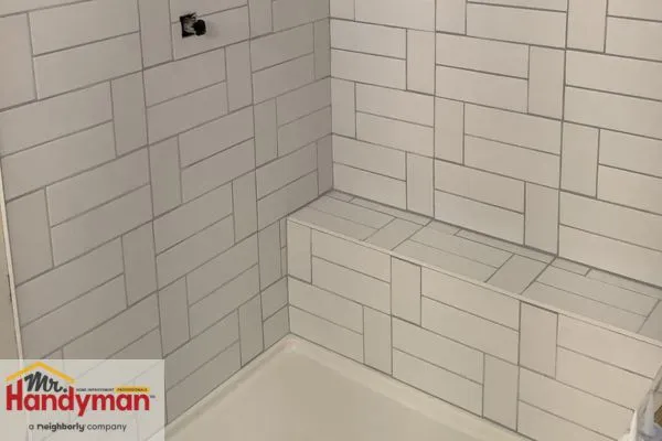 Mr. Handyman professional installing shower tiles in Northern St Joseph