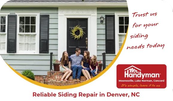 Family sitting on front steps of a house.