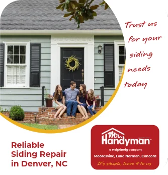 Family sitting on front steps of a house.