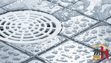 Restaurant floor drain maintenance and cleaning in South Bend Indiana commercial kitchen.